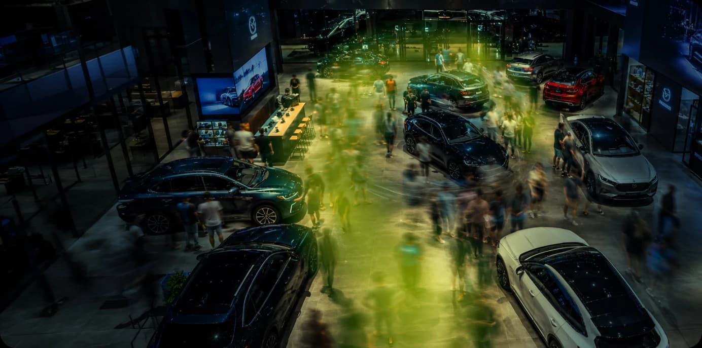 Car showroom with visitors
